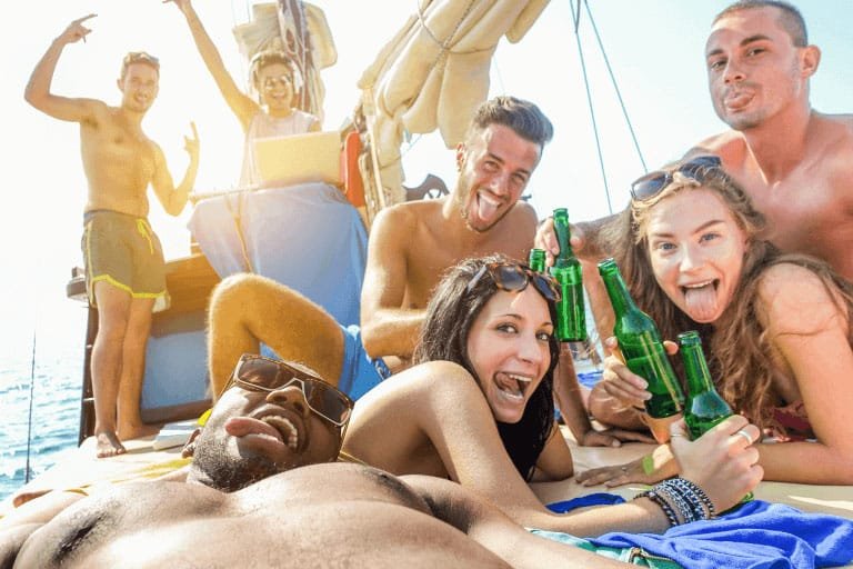 Friends drinking beer on a boat